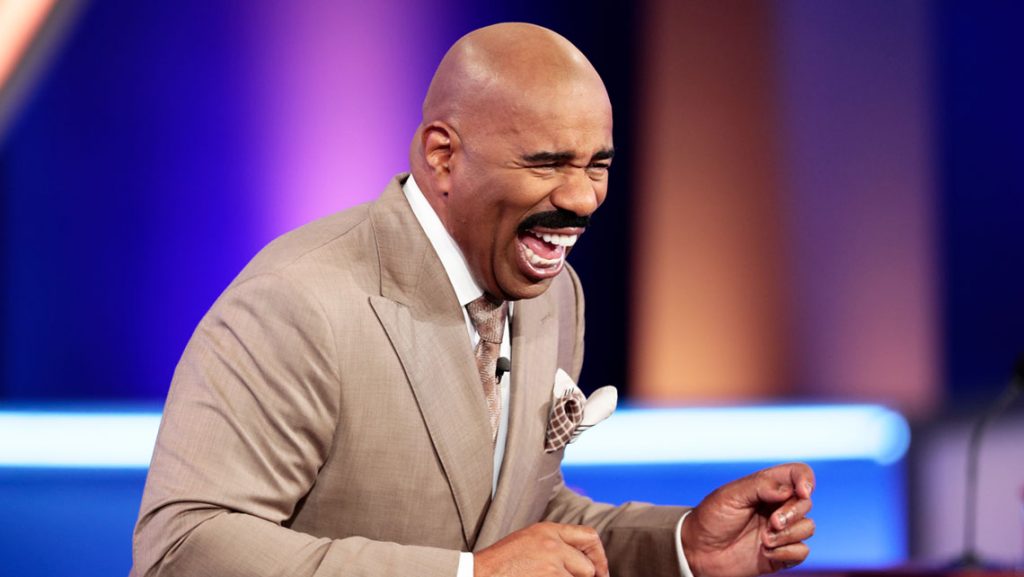 Steve Harvey laughs